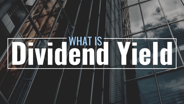 Darkened photo of a tall office building with stylized text overlay that reads "What Is Dividend Yield?"