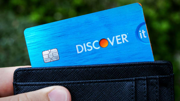 A Discover card is seen in a wallet. -lead