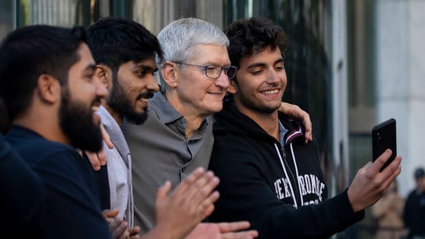 NEW YORK, NY - SEPTEMBER 20: Apple CEO Tim Cook greets customers and takes photos with them as they enter Apple's flagship 5th Avenue store to purchase the new iPhone 11 on September 20, 2019 in New York City.  Apple's new iPhone 11 goes on sale today at the grand re-opening of the 5th Avenue store. (Photo by Drew Angerer/Getty Images)