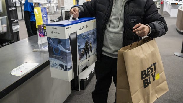 A shopper with a Sony Playstation 5 at a Best Buy store on Black Friday in San Francisco, California, US, on Friday, Nov. 25, 2022. US retailers are bracing for a slower-than-normal Black Friday as high inflation and sagging consumer sentiment erode Americans demand for material goods. Photographer: David Paul Morris/Bloomberg via Getty Images