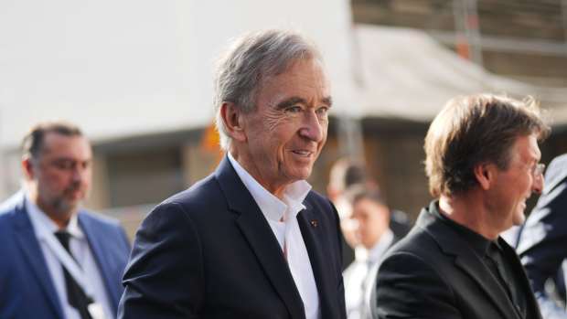 PARIS, FRANCE - OCTOBER 02: Bernard Arnault wears a navy blue blazer jacket, a white shirt, outside Louis Vuitton , during the Womenswear Spring/Summer 2024 as part of  Paris Fashion Week on October 02, 2023 in Paris, France. (Photo by Edward Berthelot/Getty Images)