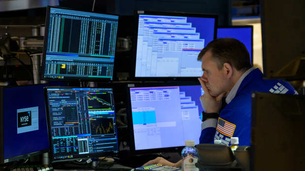 Traders work on the floor of the New York Stock Exchange during opening bell in New York City on January 18, 2023. - Wall Street stocks climbed early on January 18, 2023, on easing worries about further Federal Reserve moves to aggressively counter inflation following the latest US economic data. (Photo by ANGELA WEISS / AFP) (Photo by ANGELA WEISS/AFP via Getty Images)