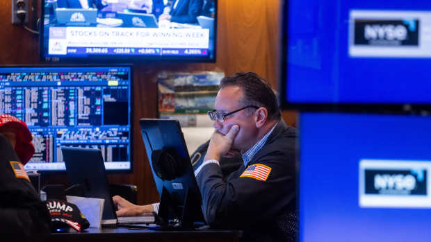 A trader works on the floor of the New York Stock Exchange (NYSE) in New York, US, on Friday, June 28, 2024. Wall Street traders sent stocks toward fresh all-time highs as signs of inflation cooling reinforced bets the Federal Reserve will be able to start cutting interest rates this year. Photographer: Michael Nagle/Bloomberg via Getty Images