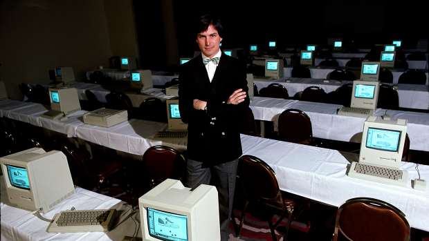 Steve Jobs with room full of computers, 1984. 