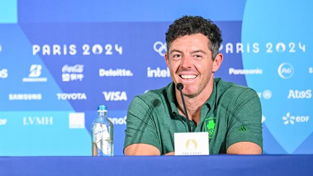 Shane Lowry and Rory McIlroy of Team Ireland smile at a press conference during practice for the Olympic men's golf competition on day four of the Olympic Games Paris 2024 at Le Golf National on July 30, 2024 in Saint-Quentin-en-Yvelines, France. 