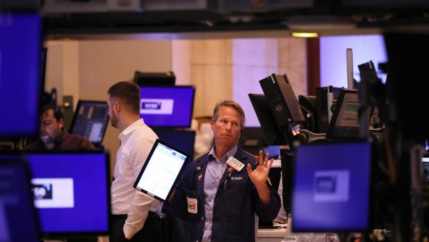 NEW YORK, NEW YORK - OCTOBER 13: Traders work on the floor of the New York Stock Exchange during afternoon trading on October 13, 2022 in New York City. U.S. stocks rose dramatically after falling to their lowest levels since 2020, recovering from a 500-point drop earlier in the day. (Photo by Michael M. Santiago/Getty Images)