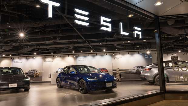 SHINJUKU, TOKYO, JAPAN - 2024/07/11: Tesla model 3 seen on display at their store in Tokyo. (Photo by Stanislav Kogiku/SOPA Images/LightRocket via Getty Images)