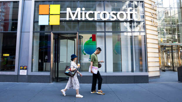 NEW YORK, NEW YORK - JULY 19: People walk by the Microsoft Office building on 41st street and 8th avenue on July 19, 2024 in New York City. (Photo by Craig T Fruchtman/Getty Images)