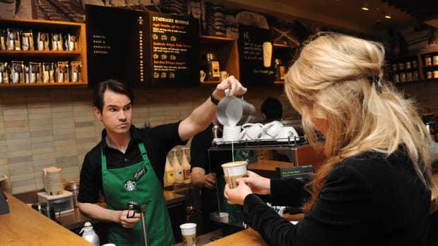 LONDON, UNITED KINGDOM - MARCH 14: Jimmy Carr (L) launches new stronger British Latte  at Starbucks on March 14, 2012 in London, England. (Photo by Stuart Wilson/Getty Images)