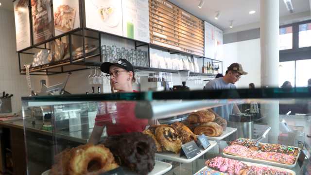 A store manager works in the cafe at Foxtrot in Chicago.