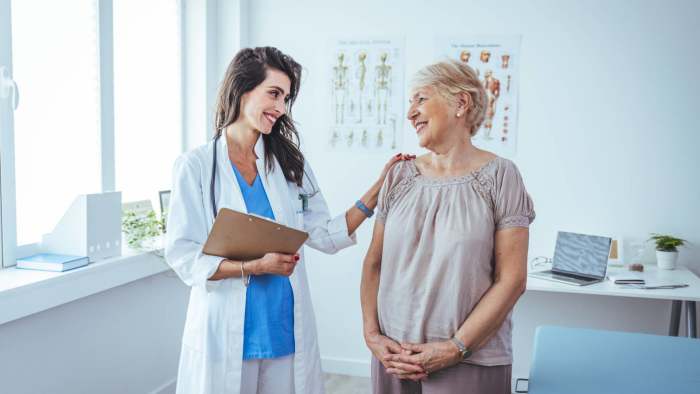 A doctor speaks with a Medicare patient in a hospital. -Management