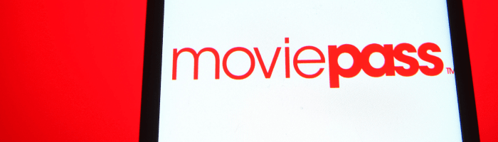 Wide, short photo of part of a smartphone screen displaying the MoviePass logo in red on a white background