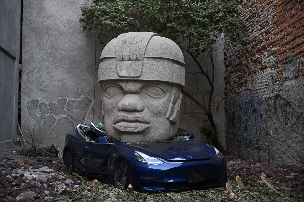 Tesla crushed by giant head — why this artist is trolling Elon Musk ...