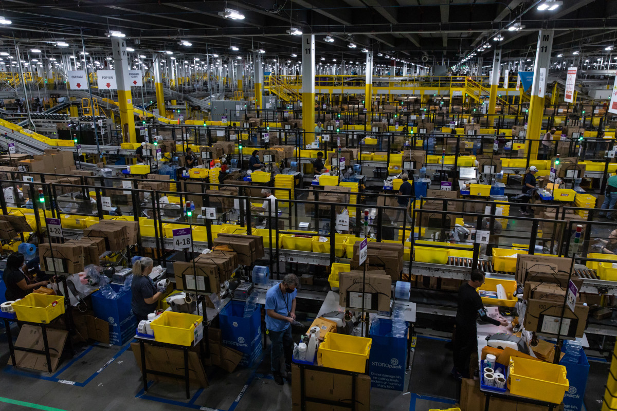 Workers fulfill orders at an Amazon fulfillment center on Prime Day in Raleigh, North Carolina.