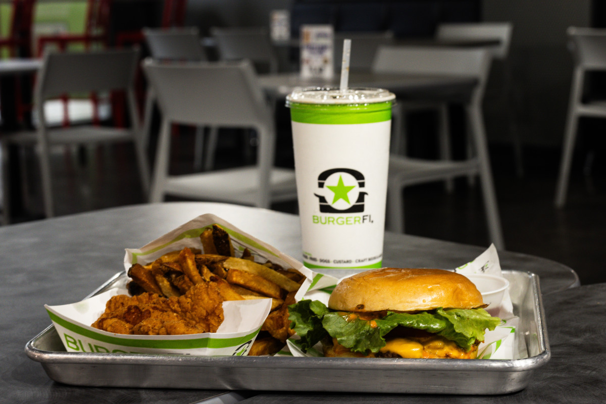 ARLINGTON, VIRGINIA - AUGUST 20: In this photo illustration, a burger, fries, and chicken tenders from BurgerFi are displayed on August 20, 2024 in Arlington, Virginia. BurgerFi International warns of possible bankruptcy, joins growing list of embattled restaurant brands in 2024. (Photo Illustration by Tierney L. Cross/Getty Images)