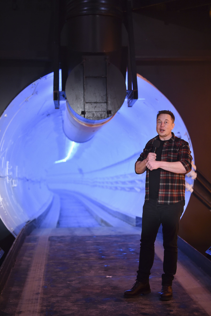 Elon Musk, co-founder and chief executive officer of Tesla Inc., speaks during an unveiling event for the Boring Co. Hawthorne test tunnel in Hawthorne, California, U.S., on Tuesday, Dec. 18, 2018. Musk took the wraps off his Boring Co.'s first completed test tunnel on Tuesday, with a lot of razzle-dazzle, the admission he had spent $40 million of his own money on the project and a surprise twist in the underlying technology. Photographer: Robyn Beck/Pool via Bloomberg